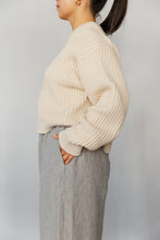 Load image into Gallery viewer, Novels Pull-On Pants feature a high waist, elastic waistband and side pockets. The fit is relaxed and slightly cropped. The pants are a true wardrobe staple for easy everyday. This is a digital product that includes pattern and sewing instructions in Finnish in PDF format.