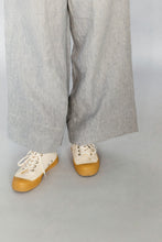 Load image into Gallery viewer, Novels Pull-On Pants feature a high waist, elastic waistband and side pockets. The fit is relaxed and slightly cropped. The pants are a true wardrobe staple for easy everyday. This is a digital product that includes pattern and sewing instructions in Finnish in PDF format.