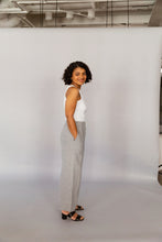 Load image into Gallery viewer, Novels Pull-On Pants feature a high waist, elastic waistband and side pockets. The fit is relaxed and slightly cropped. The pants are a true wardrobe staple for easy everyday. This is a digital product that includes pattern and sewing instructions in Finnish in PDF format.