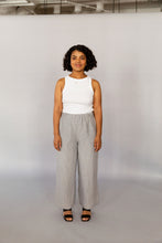 Load image into Gallery viewer, Novels Pull-On Pants feature a high waist, elastic waistband and side pockets. The fit is relaxed and slightly cropped. The pants are a true wardrobe staple for easy everyday. This is a digital product that includes pattern and sewing instructions in Finnish in PDF format. 
